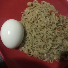 A picture of Peppered Noodles and Boiled egg.