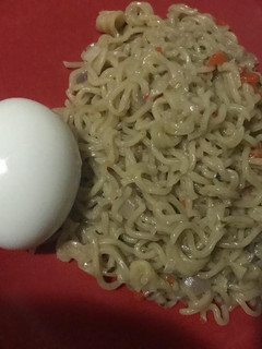 A picture of Peppered Noodles and Boiled egg.