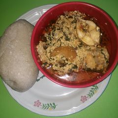 A picture of Egusi soup with mackerel & kpanla fish.