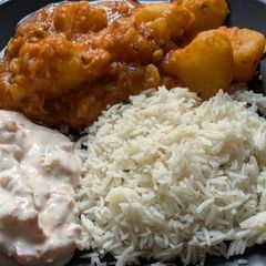 A picture of Lassaniya batata (aloo) + Raita.