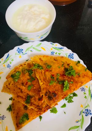 A picture of Stuffed Leftover Rice Paratha topped with Schezwan Sauce.
