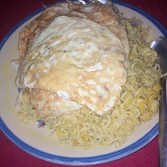 A picture of Noodles and fried egg.