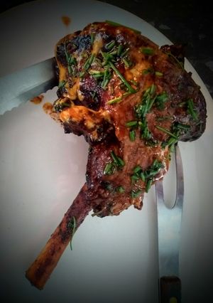 A picture of Leg of lamb with a mustard and chive glaze.