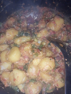 A picture of Porridge potatoes with egg and meat.