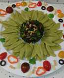 Girasol de pasta Foglie d'ulivo y espinacas salteadas con frutos secos