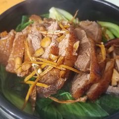 A picture of Teriyaki crispy duck over stonepot rice 脆皮鸭煲仔饭.