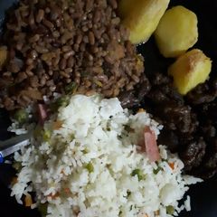 A picture of Western ndengu served with vegetable rice and beef.