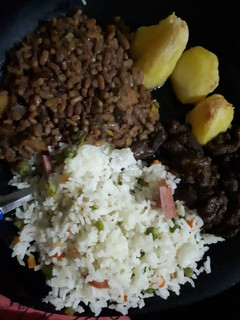 A picture of Western ndengu served with vegetable rice and beef.