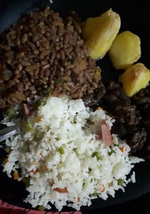A picture of Western ndengu served with vegetable rice and beef.