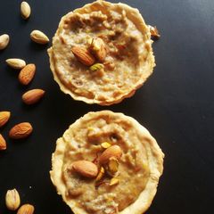 A picture of Bread and mango kheer tart.