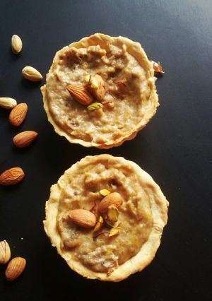 A picture of Bread and mango kheer tart.