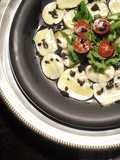 Carpaccio de boletus marinados con lima y picada de aceitunas negras