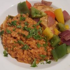 A picture of Lentil porridge with sweet peppered chicken breast.