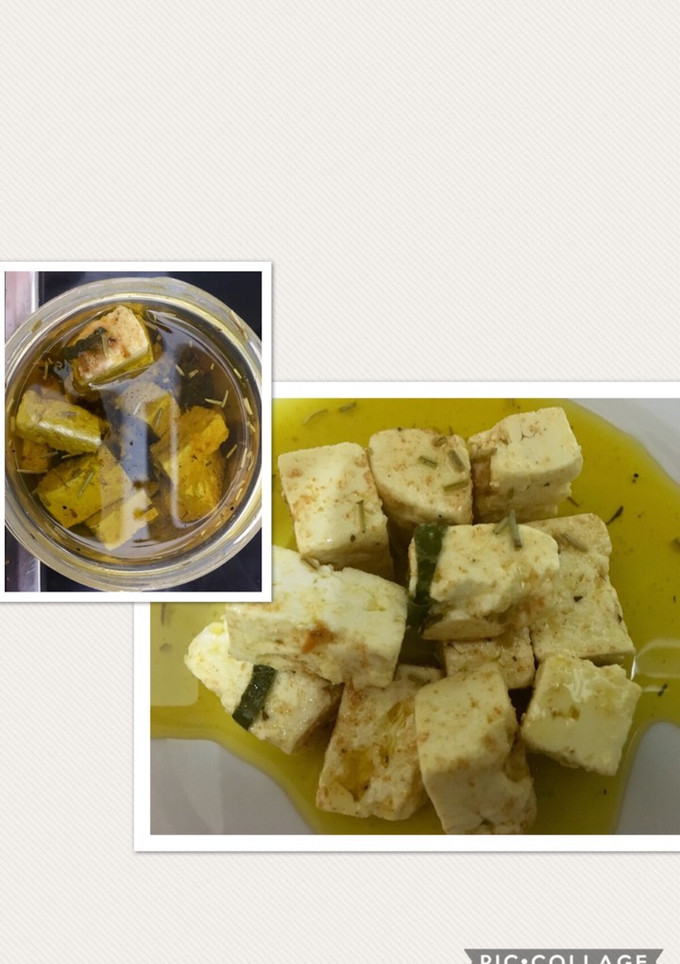 Una foto de Queso feta macerado en aceite de oliva y especias