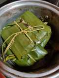Tamales de mole en hoja plátano