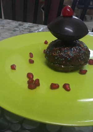 A picture of Chocolate Disc on chocolate cup cake.