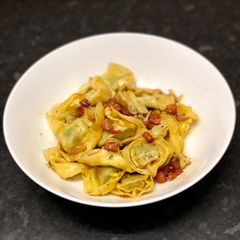 A picture of Tortellini with sage & pancetta butter.