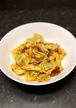 A picture of Tortellini with sage & pancetta butter.