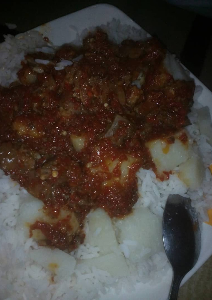 A picture of Rice &stew with aresh.