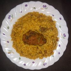 A picture of Jollof rice and beans.