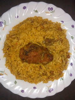 A picture of Jollof rice and beans.