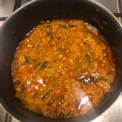 A picture of Baingan Bhartha (mashed aubergine curry).