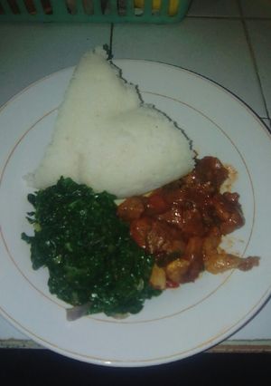 A picture of Ugali,fried meat and spinach.