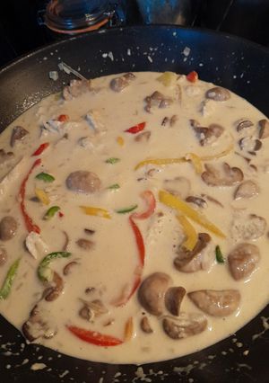 Une photo de Risotto poulet champignons poivrons
