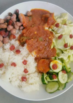 A picture of White rice with cocktail beans and ramen stew.