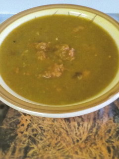 A picture of Red/Green Lentil Soup with Beef Sausage.