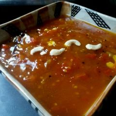 A picture of Tomato chutney with dates and mango pulp candy.