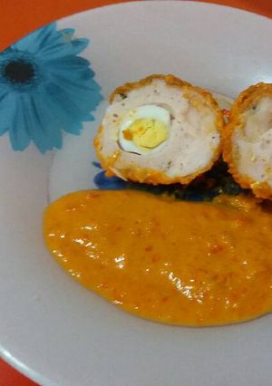 Foto principal de Huevos a la escocesa en salsa de pimientos rojos