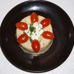 A picture of Polenta with cremini mushrooms and feta cheese.
