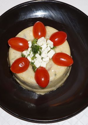 A picture of Polenta with cremini mushrooms and feta cheese.