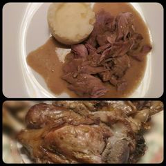 A picture of Pork hock with in season asparagus sauce.