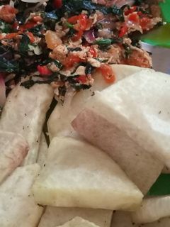 A picture of Fried yam and vegetable sauce.
