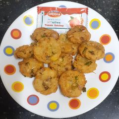A picture of Corn, cheese & vegetable fritters.
