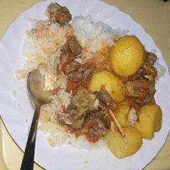 A picture of Boiled Rice, Beef stew with Potatoes.