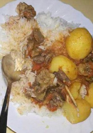 A picture of Boiled Rice, Beef stew with Potatoes.