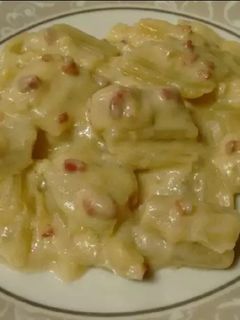 Una foto de Cardos con bechamel y jamón serrano