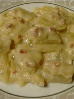 Una foto de Cardos con bechamel y jamón serrano