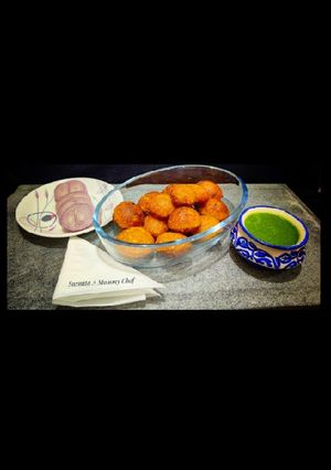 A picture of Corn fritters in appe pan.
