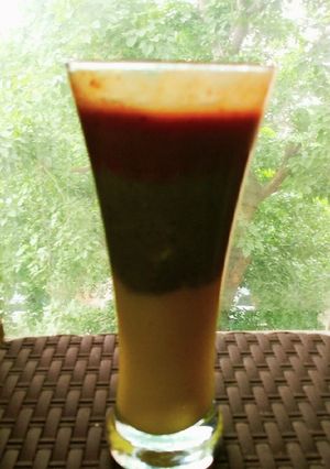 A picture of Tri-colour smoothie made from pineapple, kiwi and Cheri.