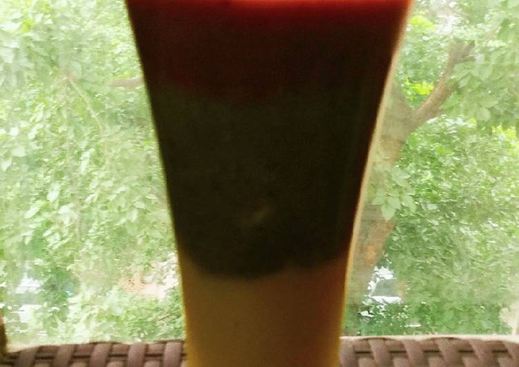 Tri-colour smoothie made from pineapple, kiwi and Cheri