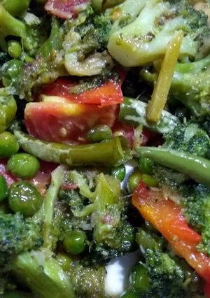 A picture of Broccoli and bell peppers stir fry.