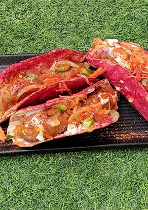 A picture of Beetroot tacos with rajma tikki.