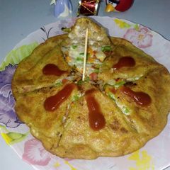 A picture of Moong daal veggie stuffed cheela.