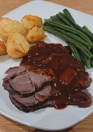 A picture of Slow Cooker Roast Beef with Red Wine Gravy.