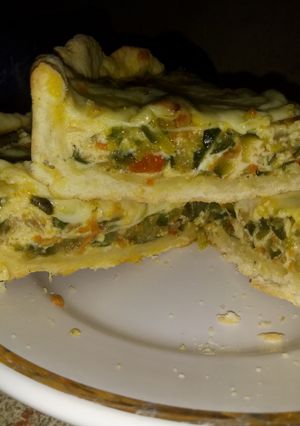 Una foto de Tarta de zapallitos con masa casera