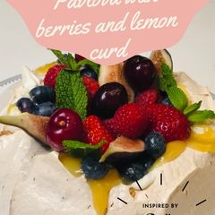 A picture of Pavlova with berries and lemon curd.